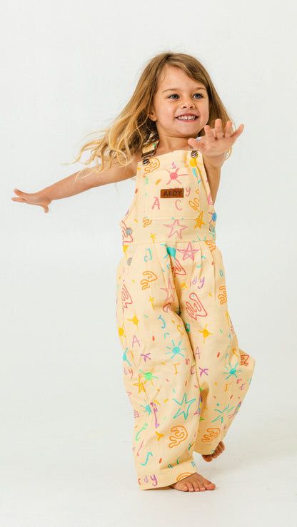 kids wearing scribble overalls during play